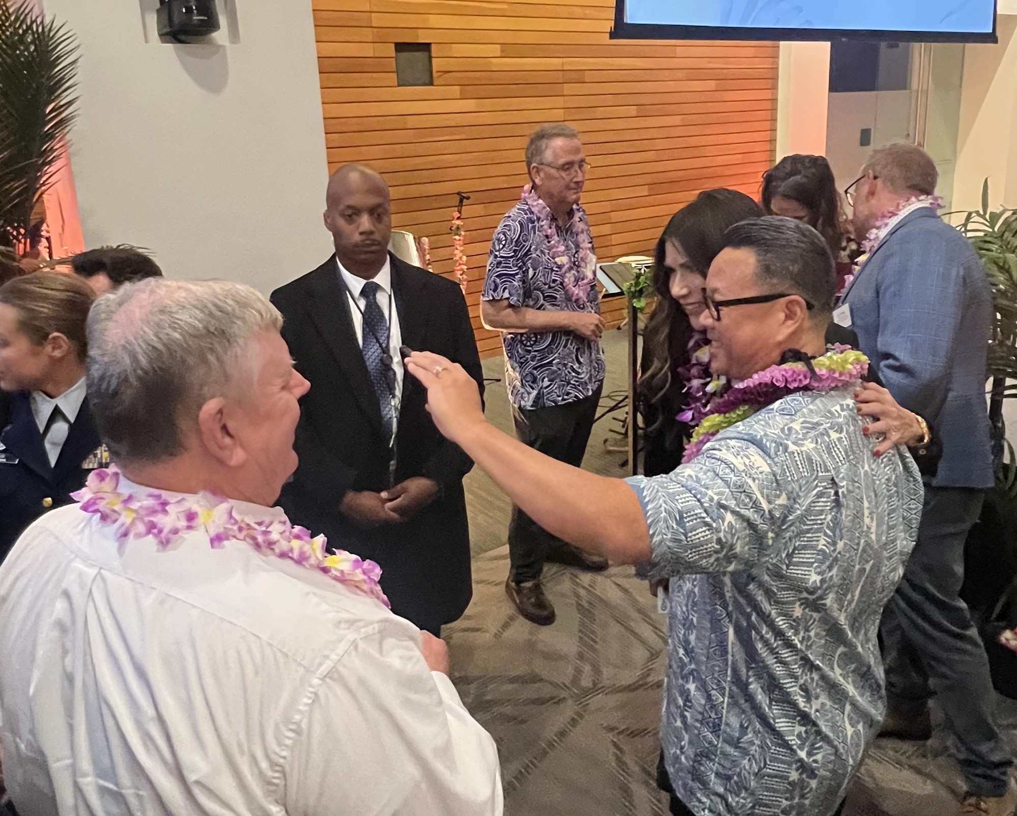 BMCS Womack (Ret) and HSCM Wong (Ret) visit with Secretary Noem at CG Holiday Reception on 10 December 2025